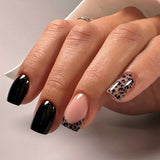 Wild Elegance short squoval press-on nails worn on a hand
